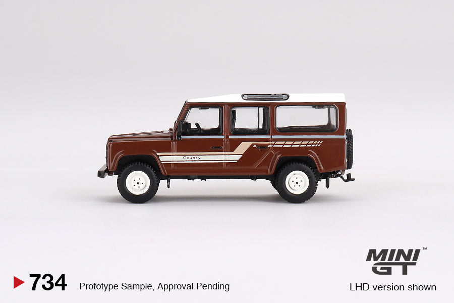 Mini GT #734: Land Rover Defender 110 1985 County Station Wagon Russet Brown 1:64