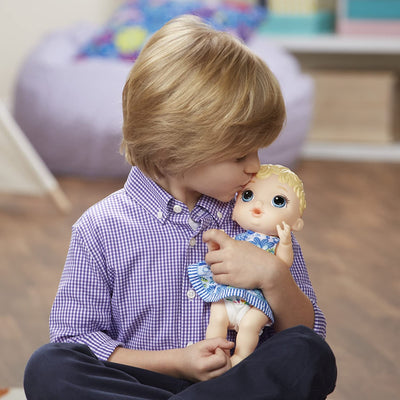 Baby-Alive-Lil_-Sips-Blonde-Baby_hald by a baby boy . boy is kissing on forehead of the doll